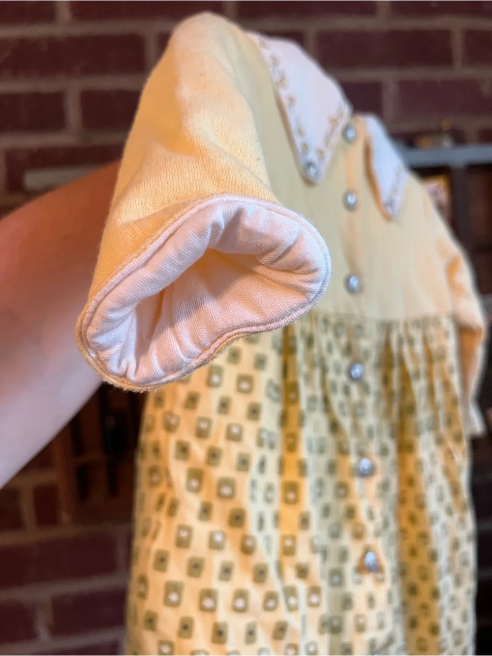 Lullaby Club Yellow Tulip Collar Baby onesie. Double layered